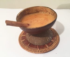 Creamy Pumpkin Spice Chai in bilo with cinnamon stick