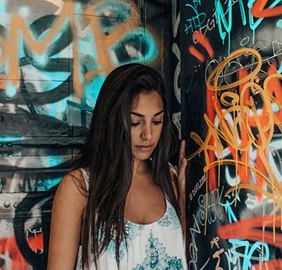 Shy girl alone in a corner at a club