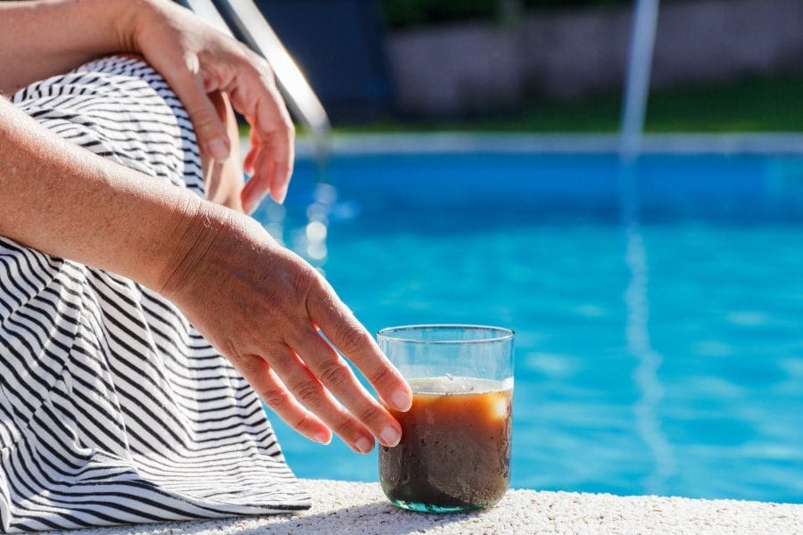 Enjoying a cup of Kava by the pool