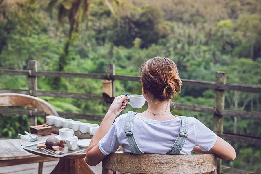 Woman enjoying kava outside on a pacific island