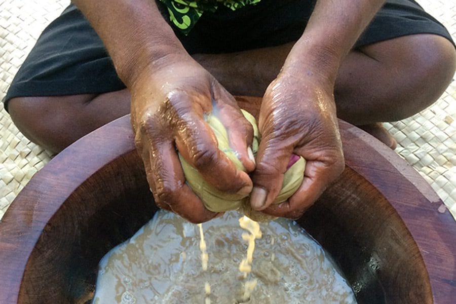 Man making kava in tanoa